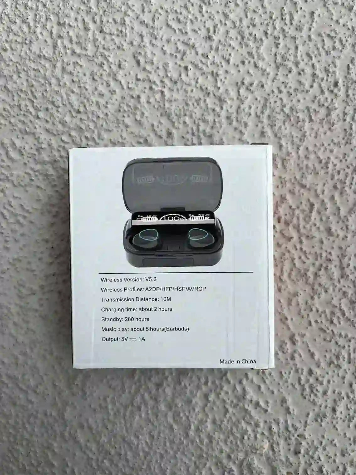 Wireless earbuds product box displaying specifications such as Bluetooth version, battery life, and charging details.