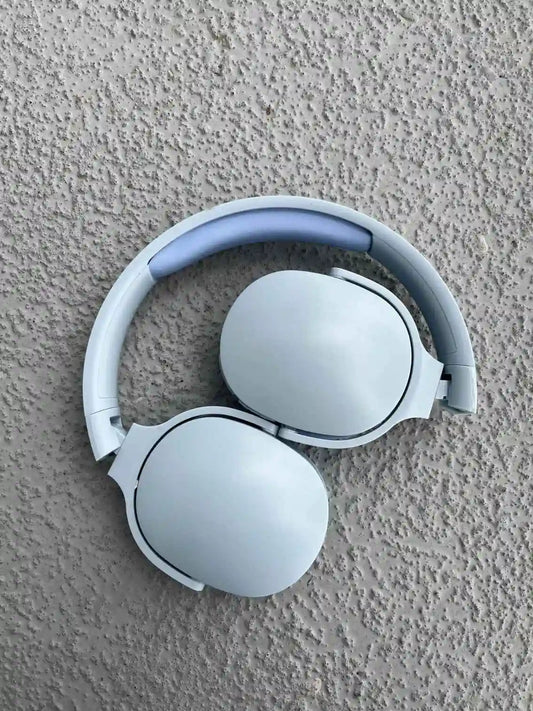 Compact blue wireless headphones with sleek design and foldable structure.