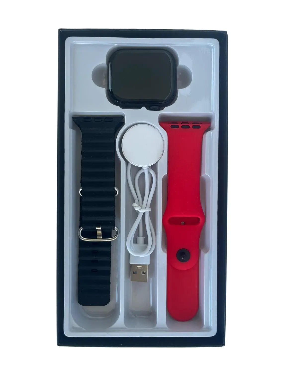 Smartwatch with black and red bands, charger, and USB cable in packaging.