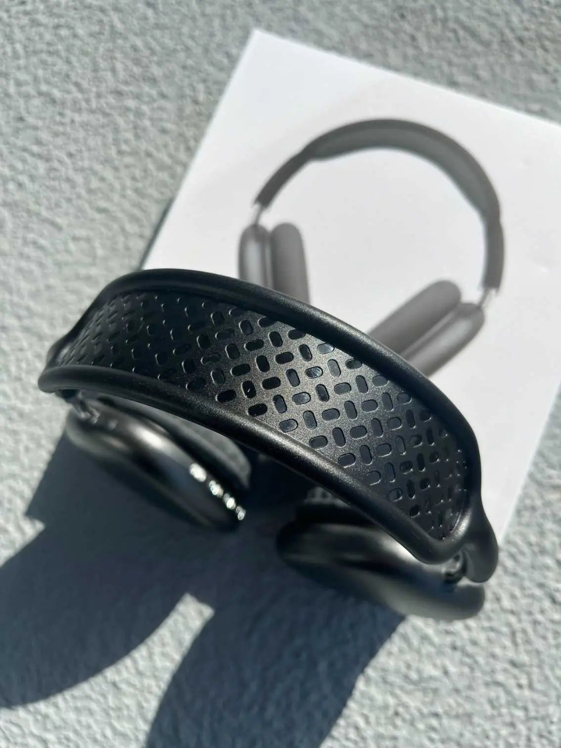 Close-up of black textured headband on P9 Pro Max headphones.