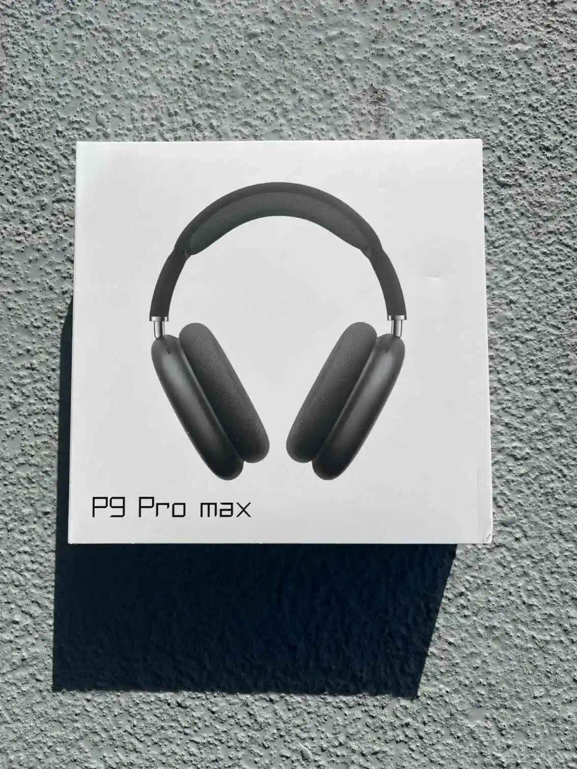 Black P9 Pro Max headphones in retail box.