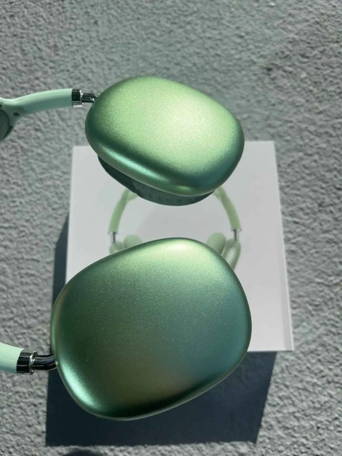 Close-up of green P9 Pro Max over-ear headphones.