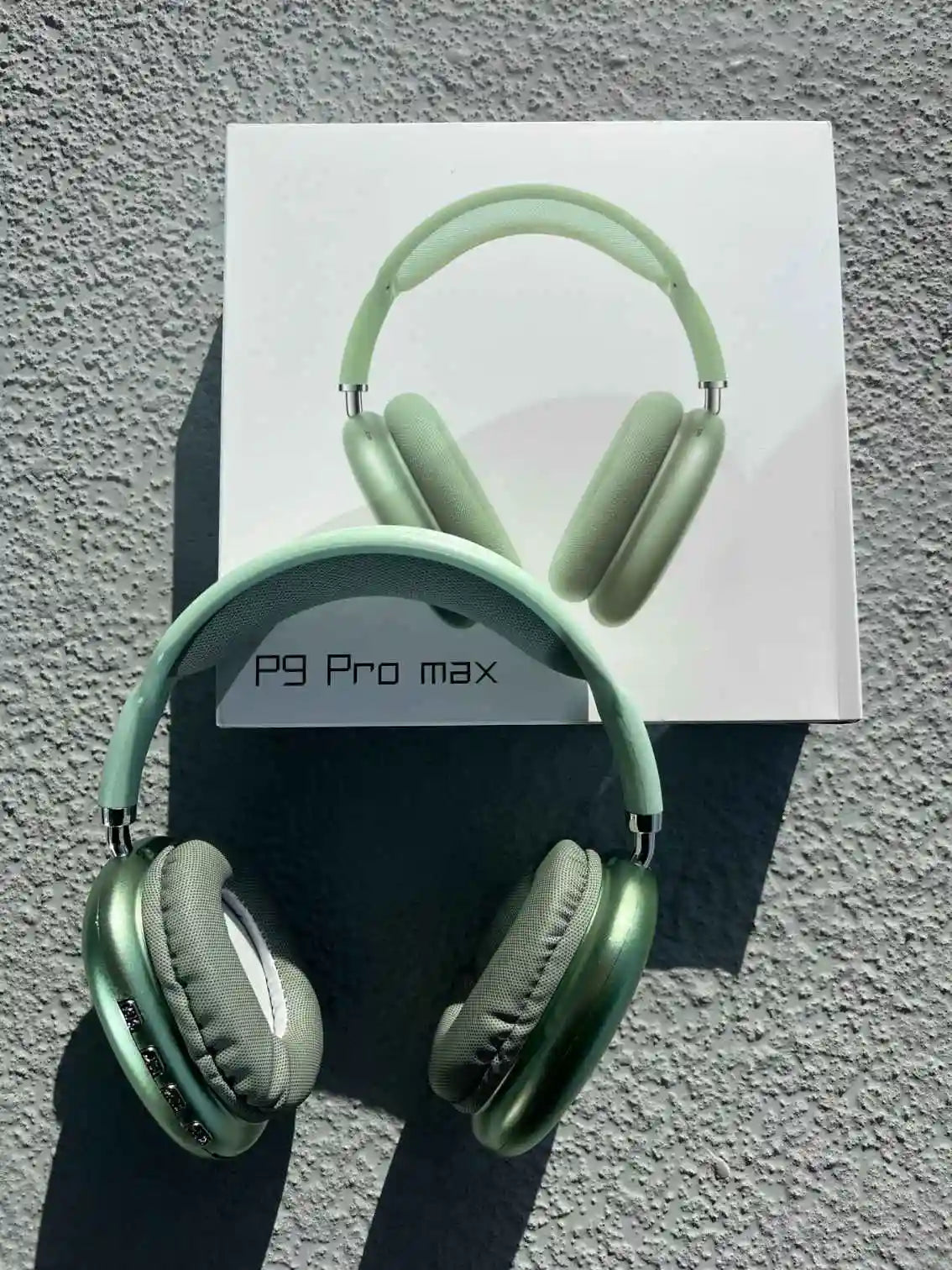 Green P9 Pro Max wireless headphones with box.