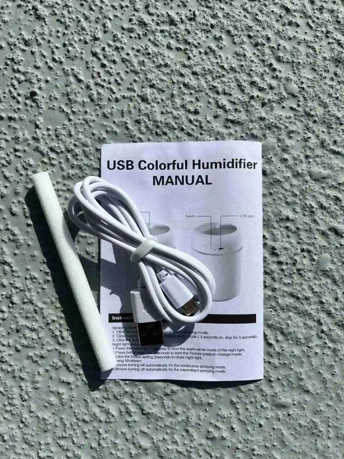 Humidifier manual, charger and extra filter.