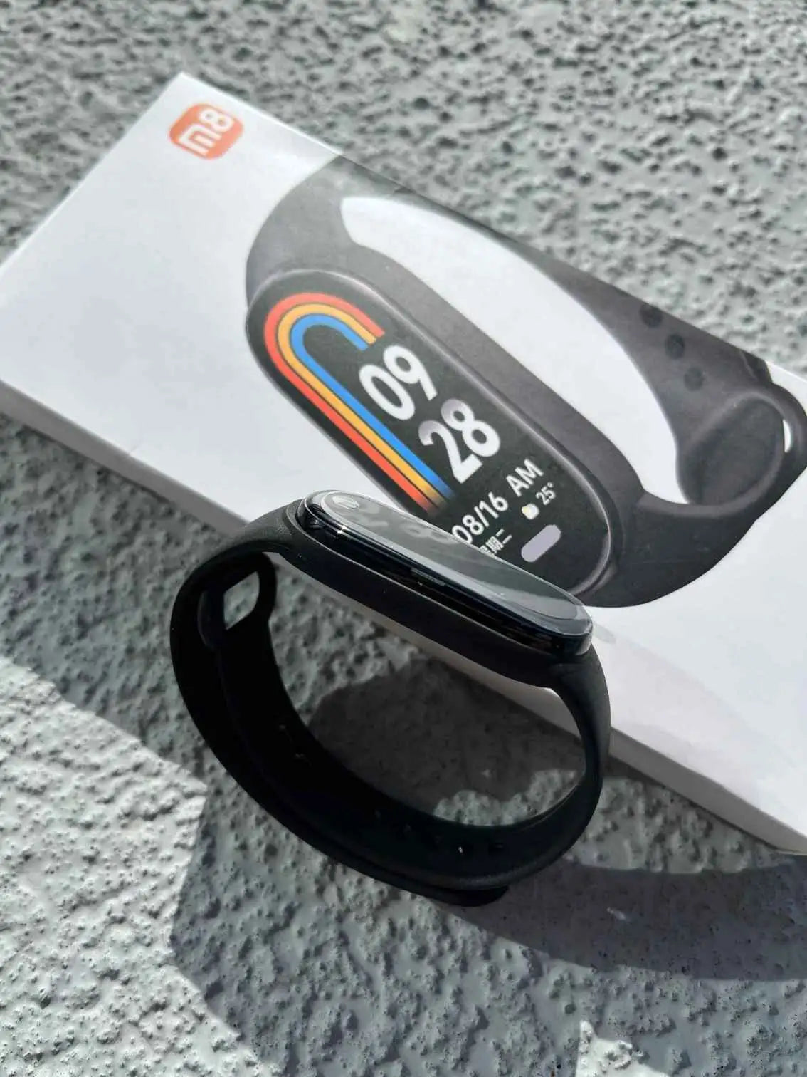 Black Smart Band 8 smartwatch with vibrant display, displayed with packaging, ideal for fitness and health tracking.