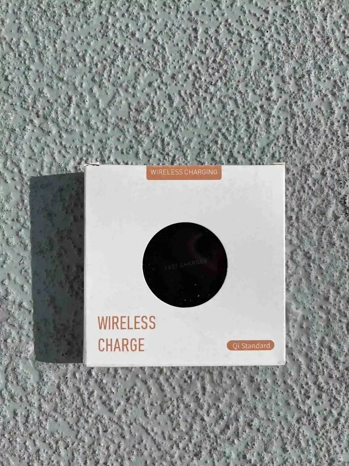 The front view of wireless charger packaging with Qi-standard compatibility is designed for fast and efficient charging.