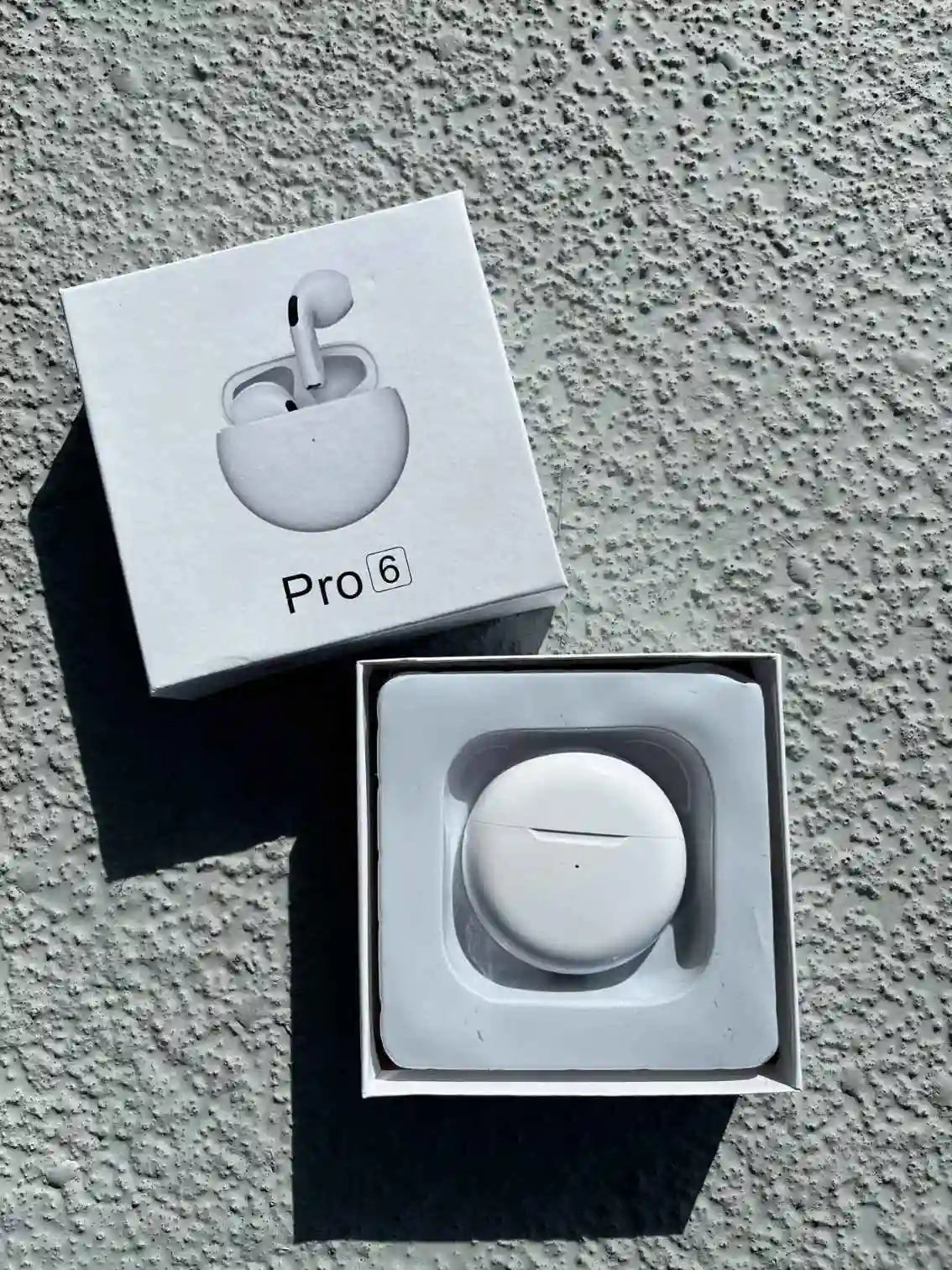 White pro wireless earphones in a box.