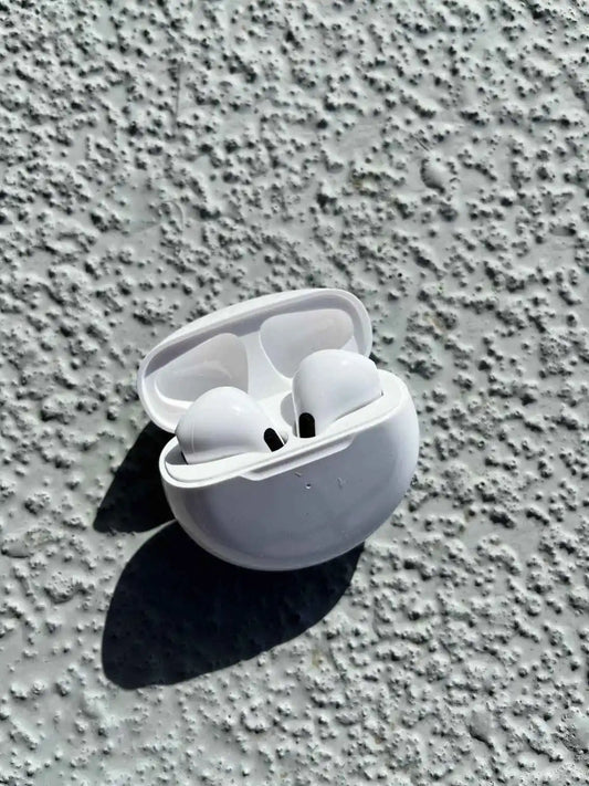 Stylish wireless earphones in white color, in a case.