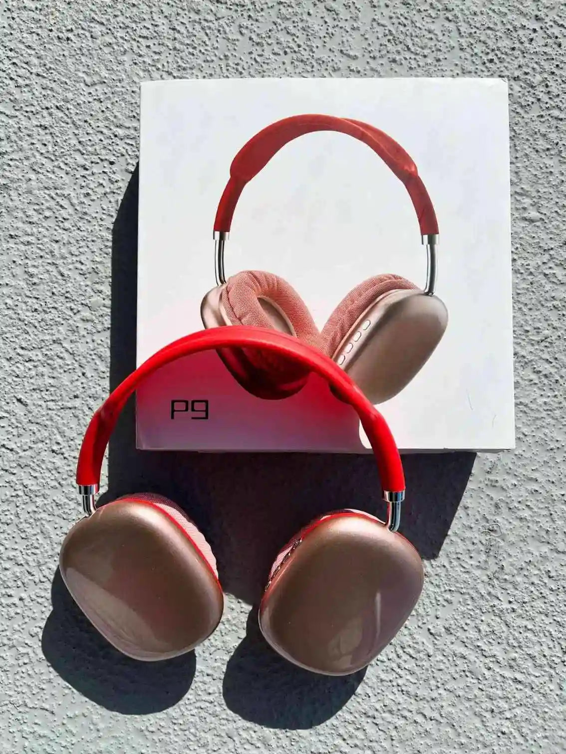 Stylish bluetooth p9 wireless headphones in red colour on the box.