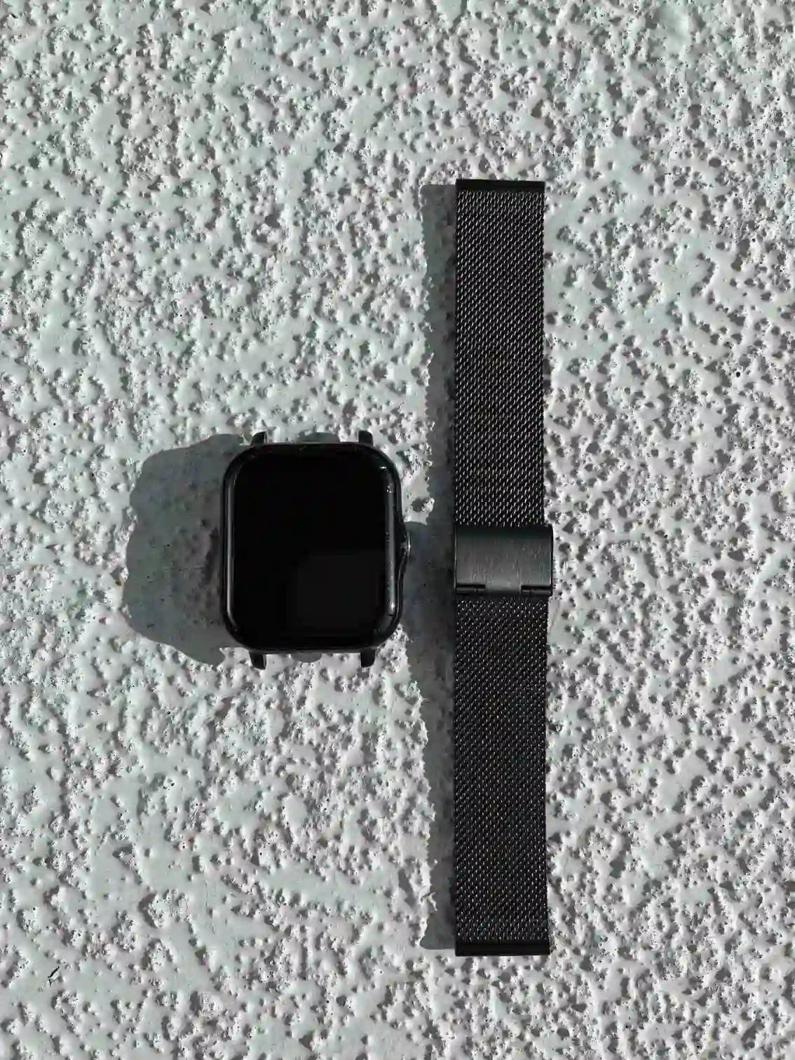 The smartwatch is black on the front side.