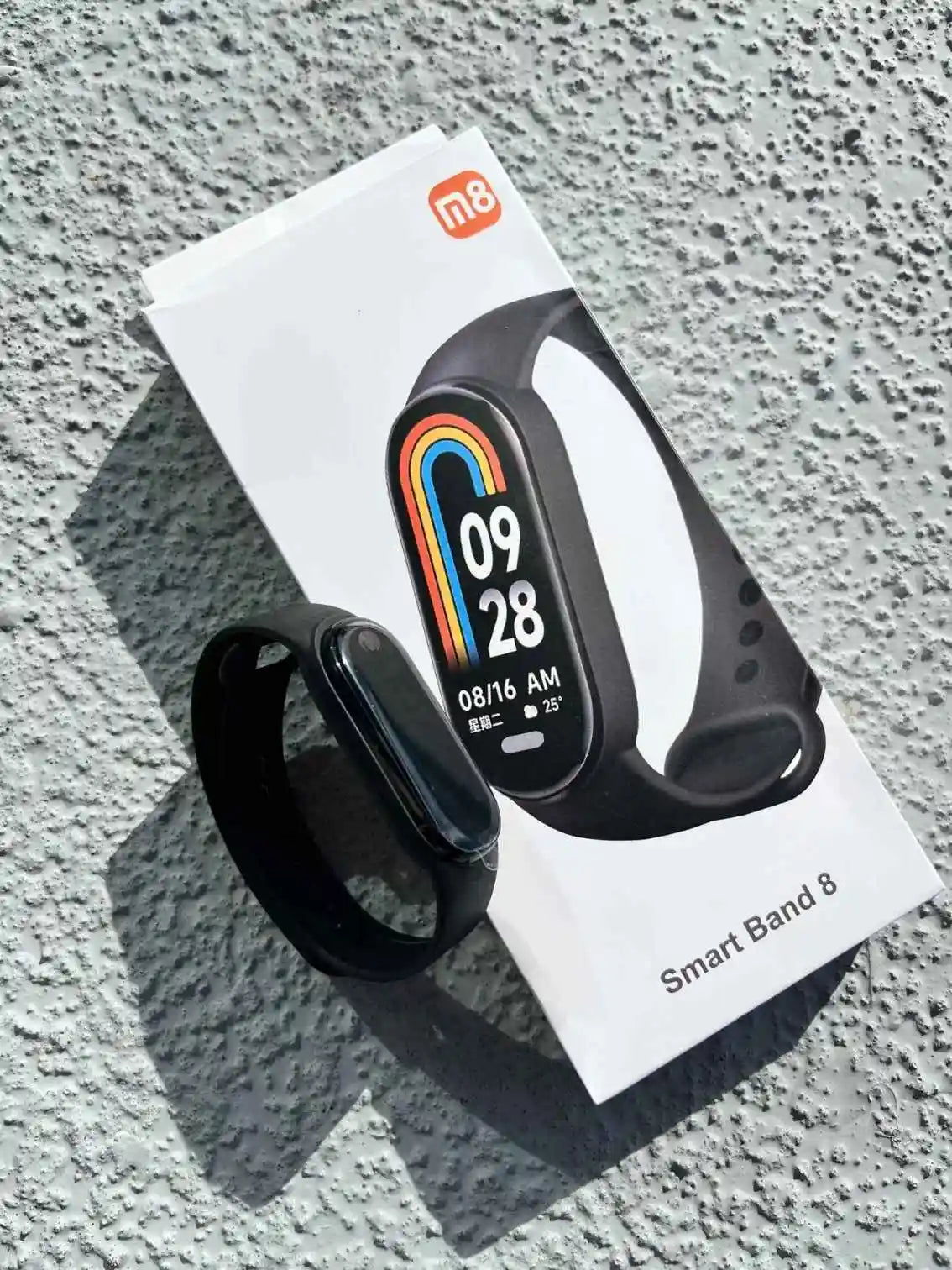 Smart Band 8 black smart watch with colorful display in original packaging, featuring health and fitness tracking features.