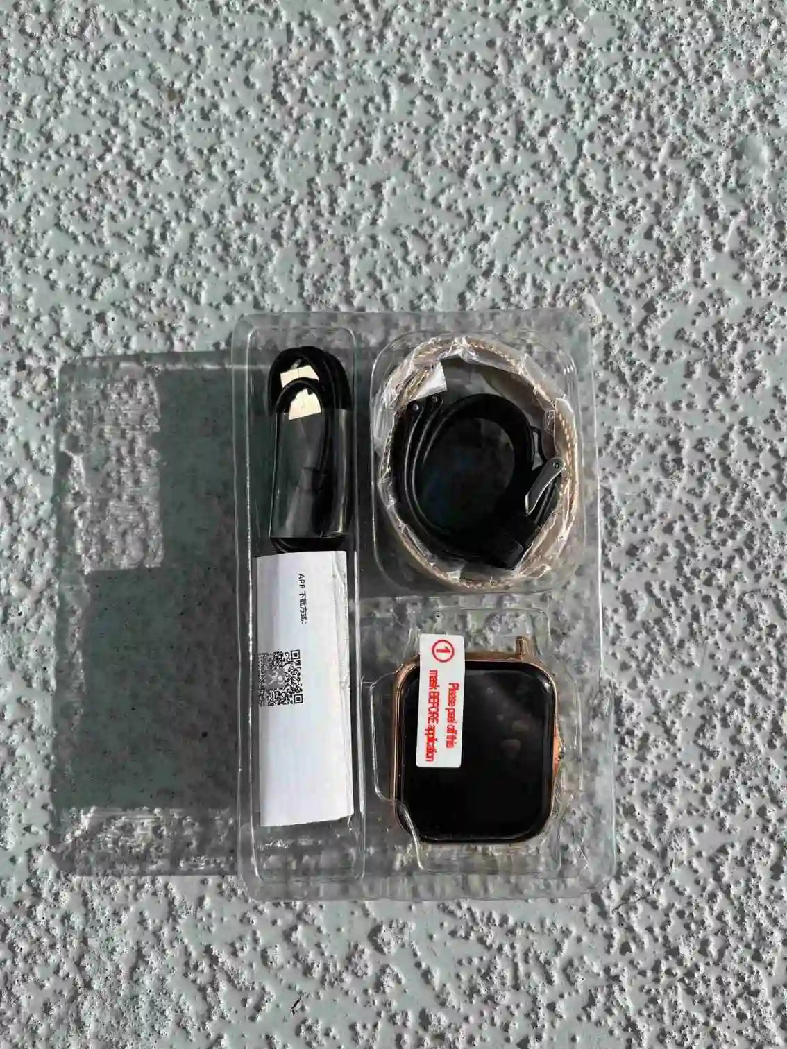 Smartwatch with all accessories in box.