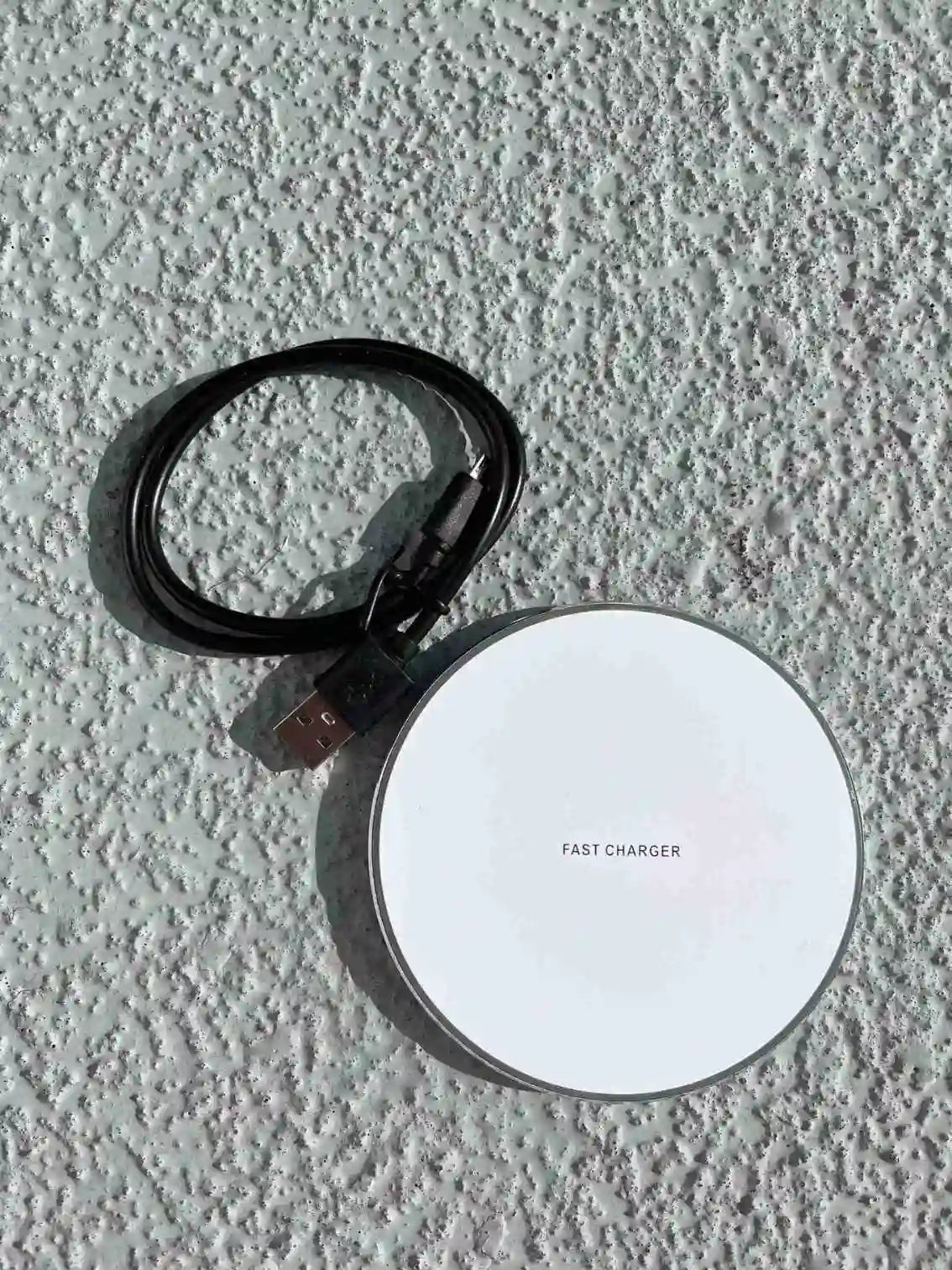 Wireless white fast charger and cable.