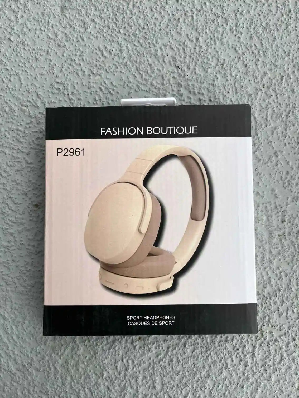 Wireless headphones model P2961 packaging with cream design.